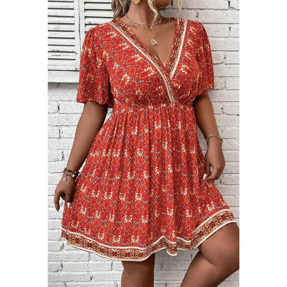 Orange Plus Size Printed Surplice Neck Empire Waist Flowy Mini Dress